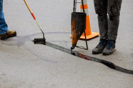 When To Repair, Resurface, And Replace Your Asphalt Driveway