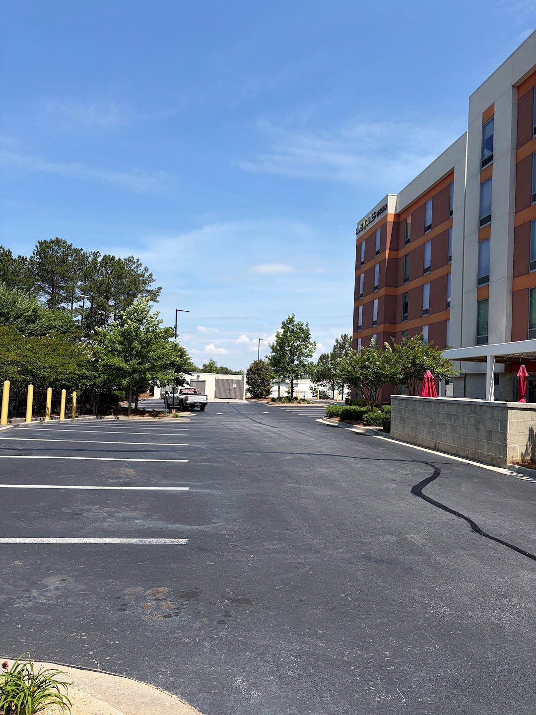 Commercial Parking Lot Crack Filling, Sealcoating & Striping by a Professional Asphalt Contractor Asphalt By Design 