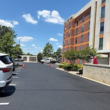 Commercial-Parking-Lot-Crack-Filling-Sealcoating-Striping-by-a-Professional-Asphalt-Contractor-Asphalt-By-Design 2