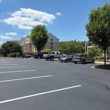 Commercial-Parking-Lot-Crack-Filling-Sealcoating-Striping-by-a-Professional-Asphalt-Contractor-Asphalt-By-Design 0