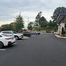 Holiday-Inn-Express-at-Eagles-Landing-Parking-Lot-Asphalt-Sealcoating-Striping-Project-Stockbridge-GA 0