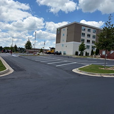 Holiday-Inn-Express-at-Eagles-Landing-Parking-Lot-Asphalt-Sealcoating-Striping-Project-Stockbridge-GA 2
